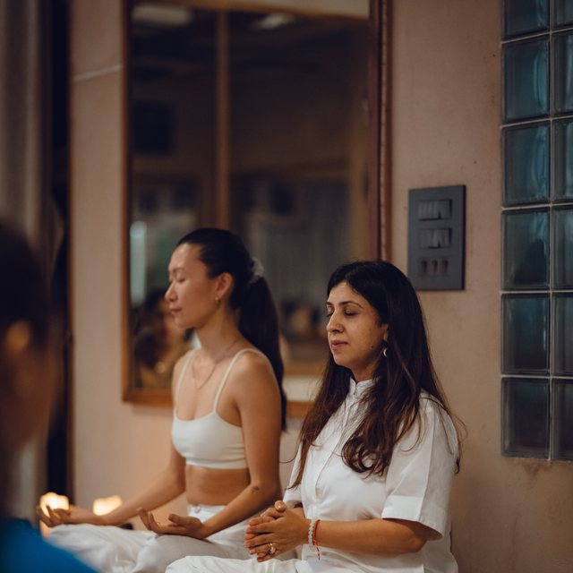 Prerna leading a guided meditation session at Kaizen